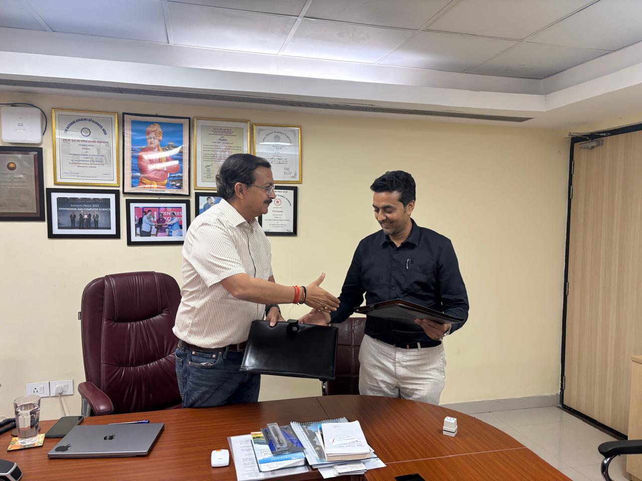 ARF and KratiTech representatives shaking hands